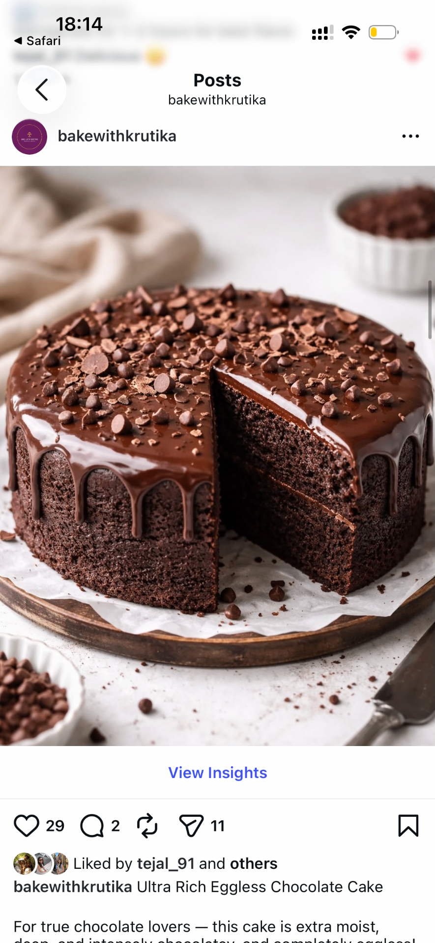 Ultra rich eggless chocolate cake with glossy ganache dripping down the sides, topped with chocolate chips